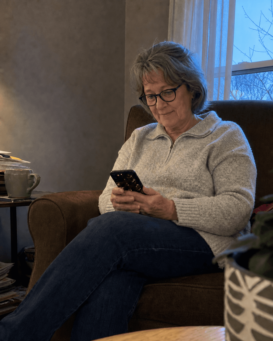 Illustration of an older woman quietly viewing her prayer page at home